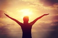 Young woman open arms on sunrise beach Royalty Free Stock Photo