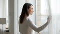 Young woman look in window dreaming or pondering Royalty Free Stock Photo