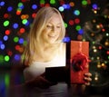 Young woman opening gift box Royalty Free Stock Photo