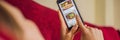 Young woman orders food for lunch online using a smartphone BANNER, LONG FORMAT