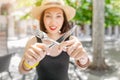 Young woman in outdoor restaurant with a knife and fork in her hands Royalty Free Stock Photo