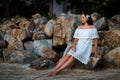 Young woman outdoors on the background of stone wall Royalty Free Stock Photo