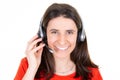 Young woman over isolated white background working with headset Royalty Free Stock Photo