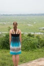 Young woman overlooking inle lake area in central myanmar