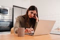 Young woman overworked exhausted of use a laptop, having stress and headache. Burnout frustrated freelance lady with Royalty Free Stock Photo