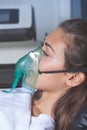 Young woman with oxygen mask