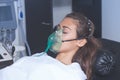 Young woman with oxygen mask