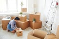 Young Woman Packing Boxes for Relocation Royalty Free Stock Photo