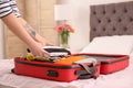 Young woman packing suitcase Royalty Free Stock Photo