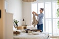 Young woman packing suitcase in the bedroom Royalty Free Stock Photo