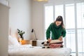 Young woman packing suitcase in the bedroom Royalty Free Stock Photo