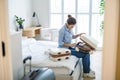 Young woman packing suitcase in the bedroom Royalty Free Stock Photo