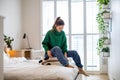 Young woman packing suitcase in the bedroom Royalty Free Stock Photo