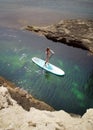 Woman Paddling on SUP board in a sea. Royalty Free Stock Photo