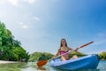 Young woman paddling during vacation in an idyllic travel destin Royalty Free Stock Photo