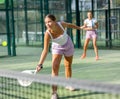 Young woman padel tennis player trains on the outdoor court Royalty Free Stock Photo