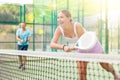 Young woman padel tennis player trains on the outdoor court Royalty Free Stock Photo