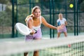 Young woman padel tennis player trains on the outdoor court Royalty Free Stock Photo