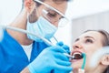 Young woman during painless oral treatment in a modern dental office Royalty Free Stock Photo