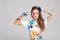 Young woman smeared in multicolored paint. Royalty Free Stock Photo