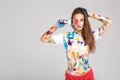 Young woman smeared in multicolored paint. Royalty Free Stock Photo