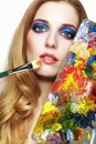 Young woman painter with color palette and paint brush Royalty Free Stock Photo