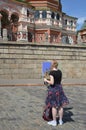 Young woman painting on a square in the centre of moscow