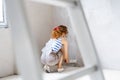 Young woman painting walls of her new house. Royalty Free Stock Photo