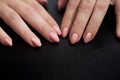 Young woman palms on black background. Close up. Beautiful Glamorous Manicure.
