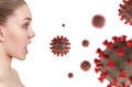 Young woman in panic looks on coronavirus cells.