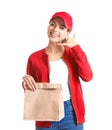 Young woman with paper bag on white background. Food delivery service