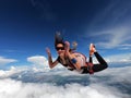 Young woman parachutist smiling in free fall. Royalty Free Stock Photo