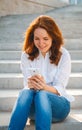 Young woman in the park with phone Royalty Free Stock Photo