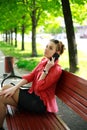 Young woman in a park talking on the phone