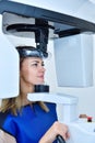 Young woman patient make a x-ray picture on dental a tomograph Royalty Free Stock Photo