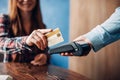 Young woman paying with credit card in cafe Royalty Free Stock Photo