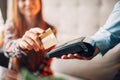 Young woman paying with credit card in cafe Royalty Free Stock Photo