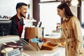 Young woman paying credit card for purchases in grocery store. Royalty Free Stock Photo