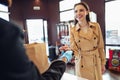 Young woman paying credit card for purchases in grocery store. Royalty Free Stock Photo