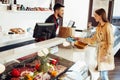 Young woman paying credit card for purchases in grocery store. Royalty Free Stock Photo