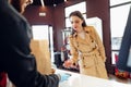 Young woman paying credit card for purchases in grocery store. Royalty Free Stock Photo