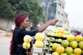Young woman paying fruits at street market. Royalty Free Stock Photo
