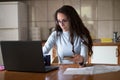 Young woman paying bills with debit card from home Royalty Free Stock Photo