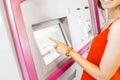 Woman paying at ticket machine in a metro or railroad station Royalty Free Stock Photo