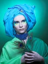 Young woman with peacock feathers Royalty Free Stock Photo