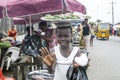 A young woman peddler of okra fruit Royalty Free Stock Photo