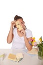 Young woman peeping through a cheese with holes Royalty Free Stock Photo