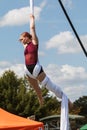 Young Woman Performs Aerial Gymnastics With Silks At Fall Festival