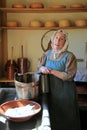 Young woman in period dress, reenacting life of a pilgrim,Old Sturbridge Village,Massachusetts,September,2014 Royalty Free Stock Photo