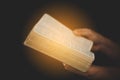 Young woman person hand holding holy bible with study at home. Adult female christian reading book in church. Girl learning Royalty Free Stock Photo